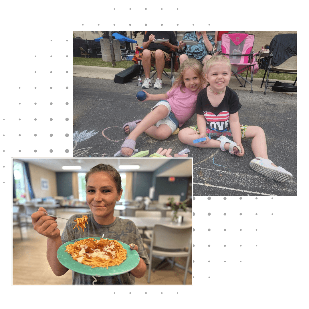 Two women hugging and smiling joyfully while taking a selfie together.